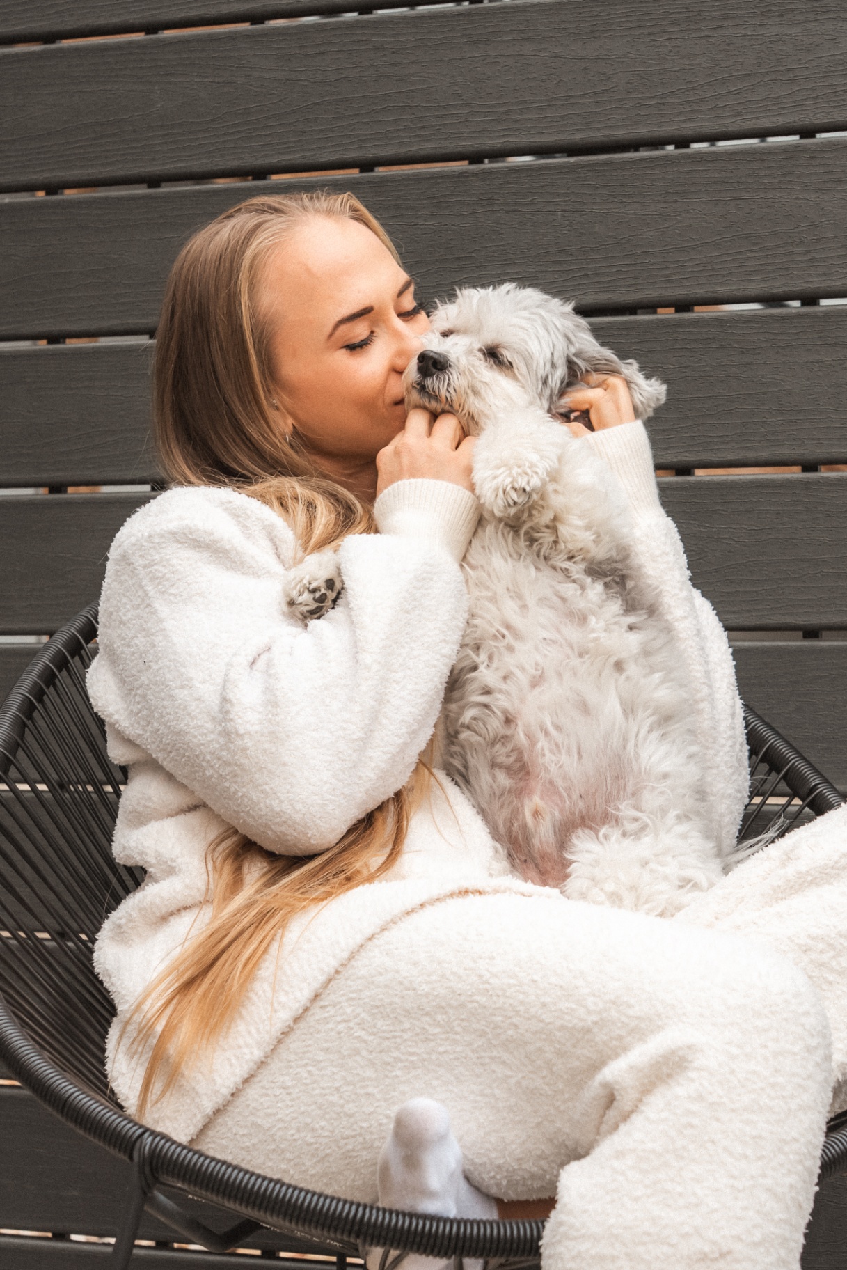 Sarah getting a kiss from her dog