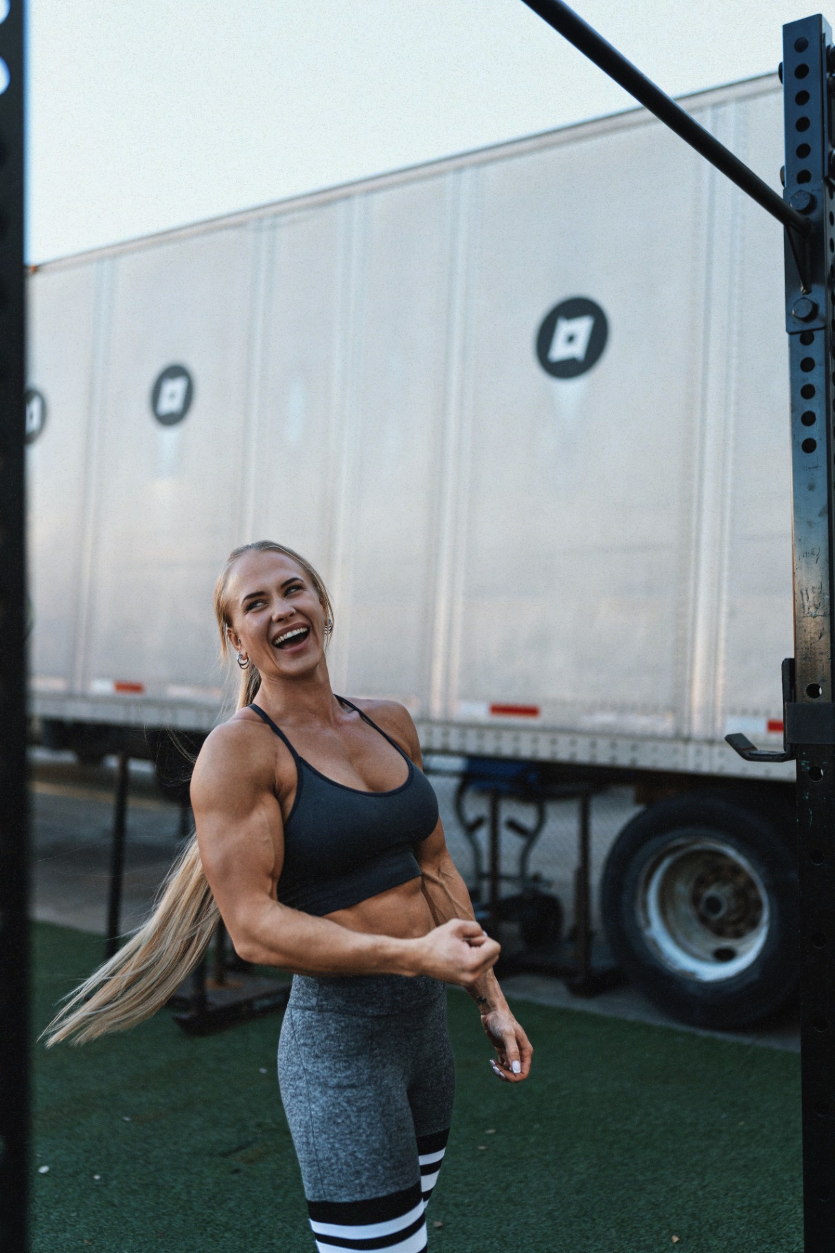 Sarah laughing outdoors, reflecting the community and support inside the program